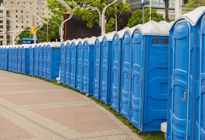 a row of portable restrooms at a fairground, offering visitors a clean and hassle-free experience in Artesia